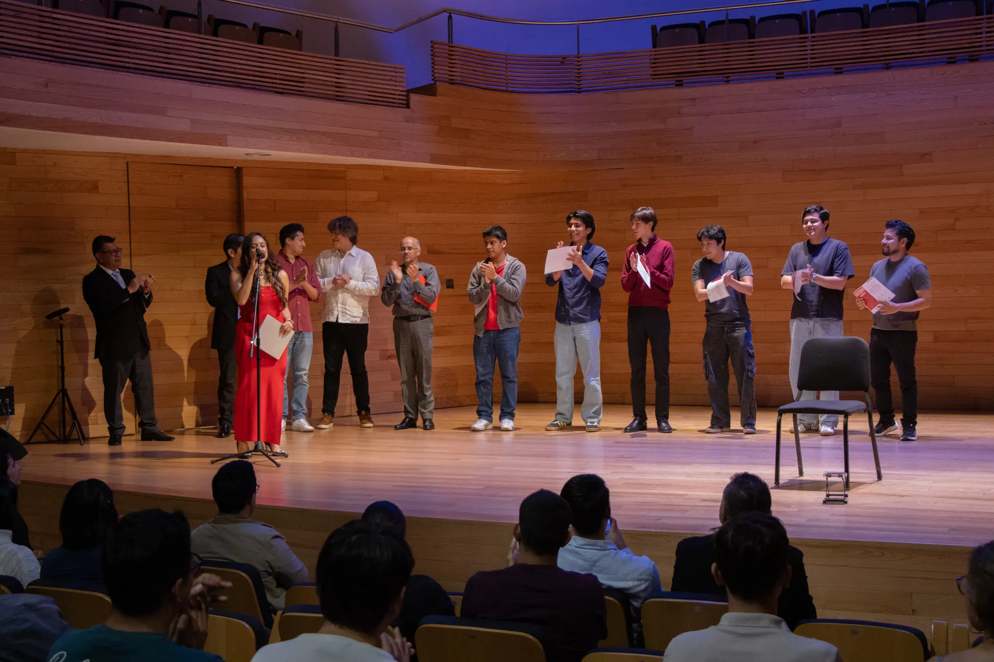 Young guitarists receiving their awards on stage